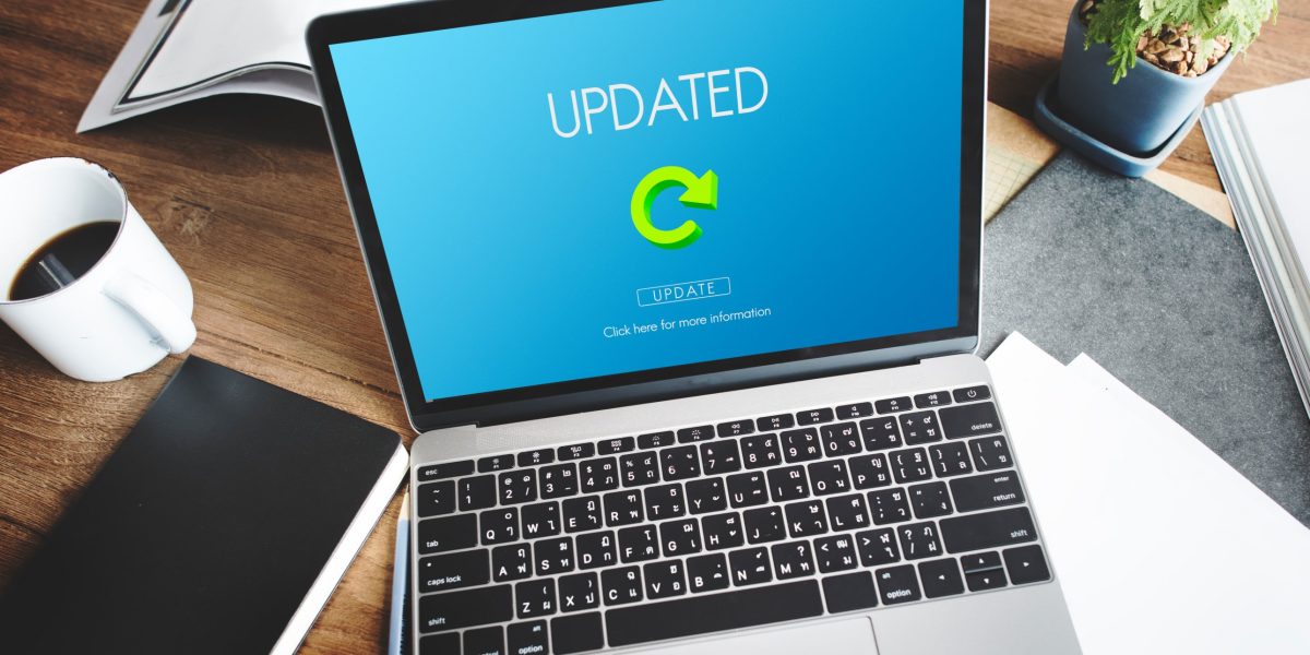 Laptop showing an updated message after a PHP and WordPress update