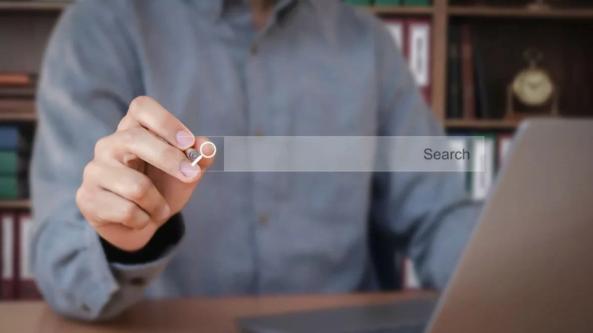 Man touching a search bar on a virtual screen